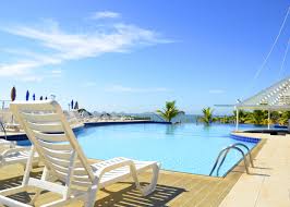 A picture of a pool at a hotel outside